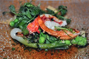 LOBSTER FROM THE GRILL Crushed green peas and new onions Kong Hans Kaelder